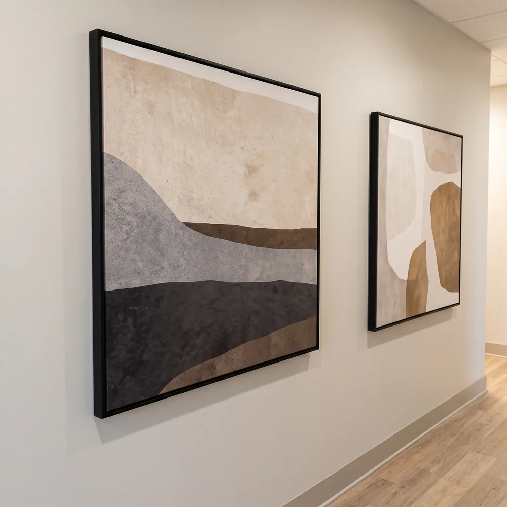Large framed abstract artwork in a Dallas-area med spa corridor