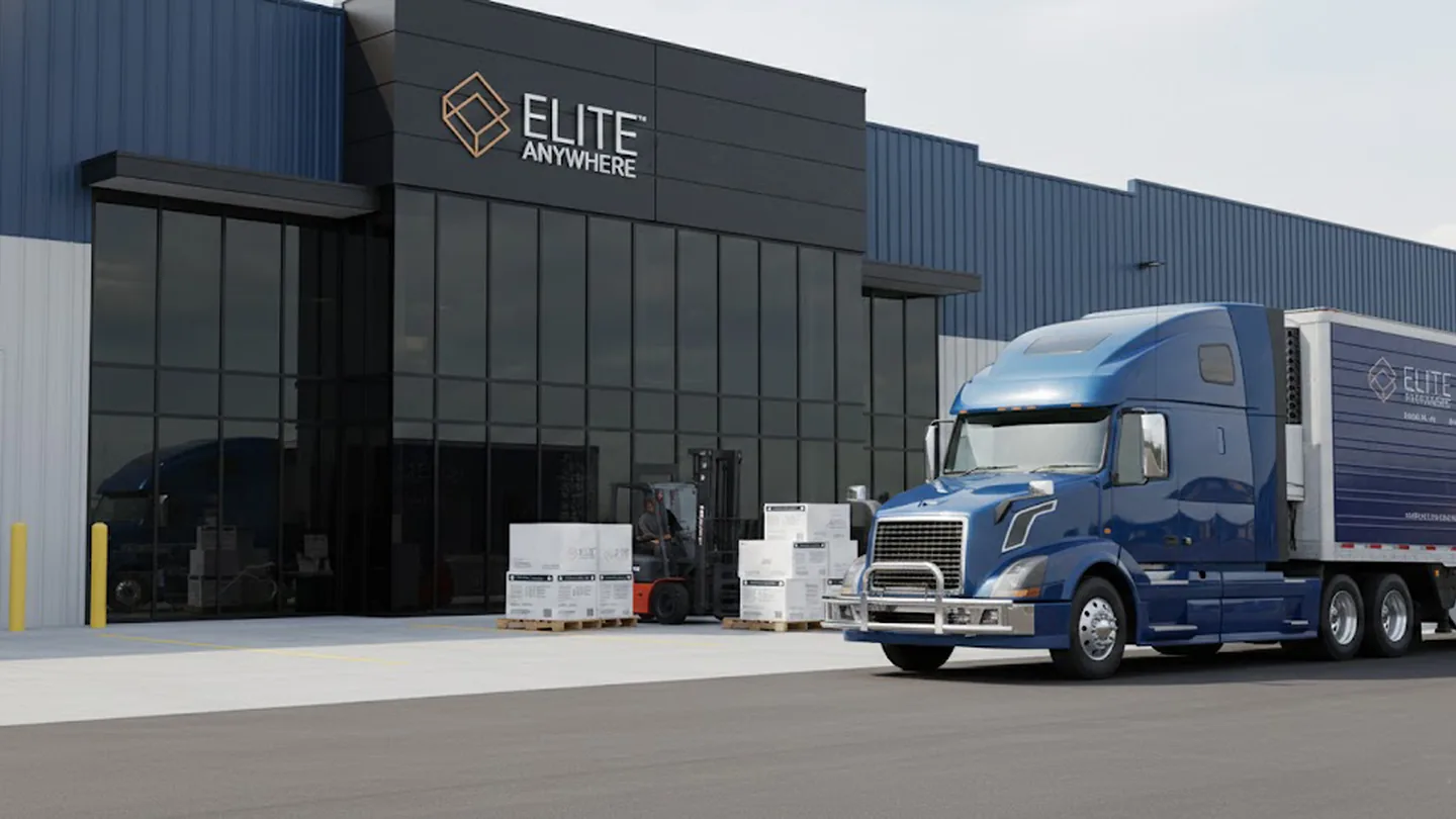 Elite Anywhere semi-truck at the warehouse dock with a forklift moving palletised freight for ocean shipping