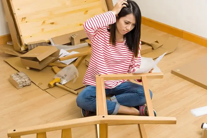 woman-trying-to-assemble-a-furniture