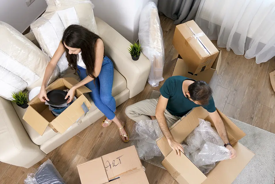 man and woman packing things