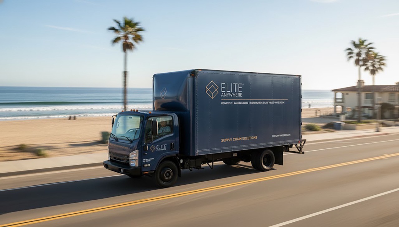 Elite Anywhere branded box truck transporting goods on the highway